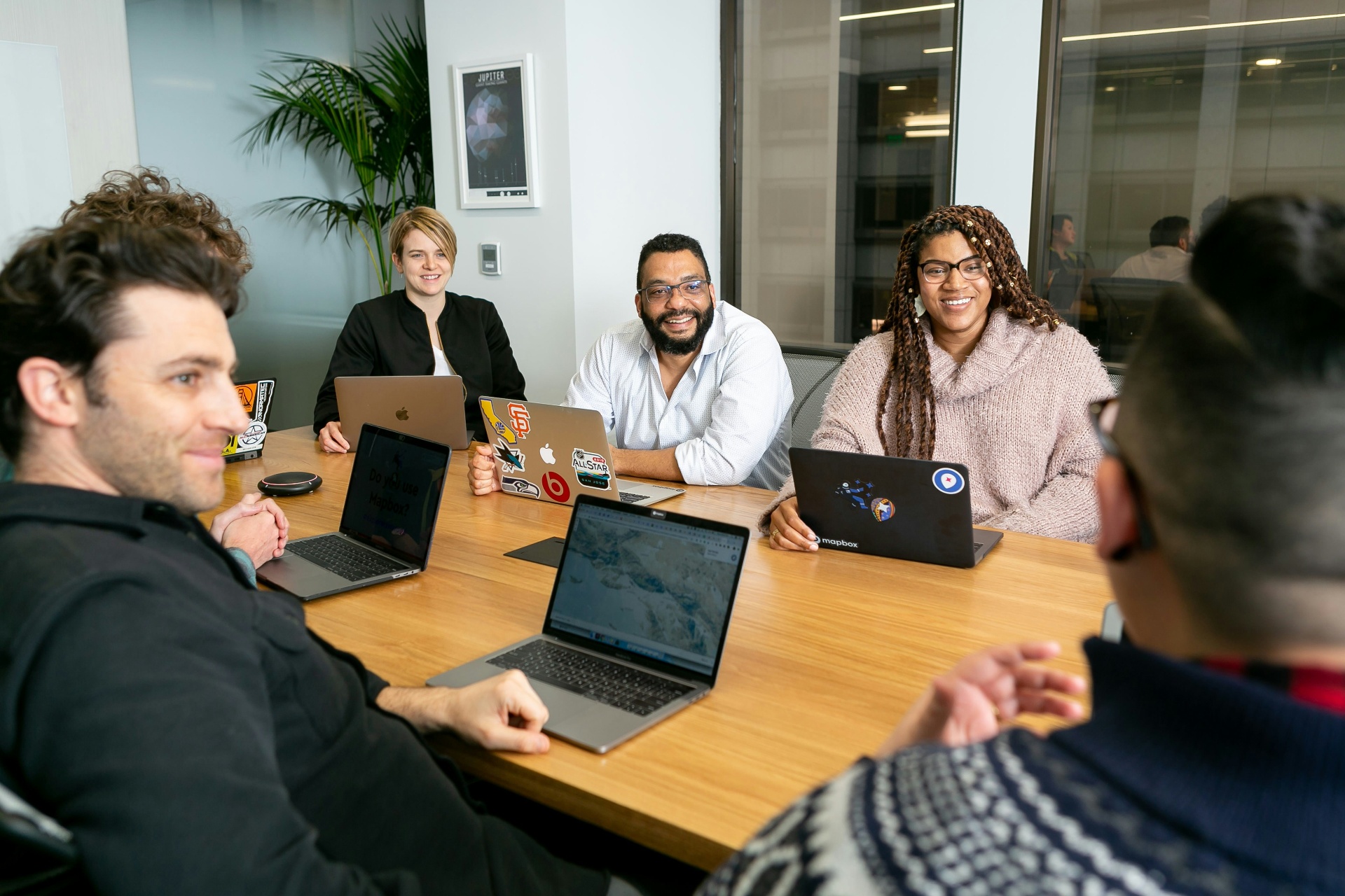 Diverse Alloy team collaborating around a conference table